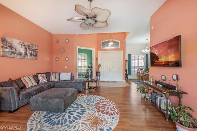 living room featuring hardwood / wood-style floors and ceiling fan