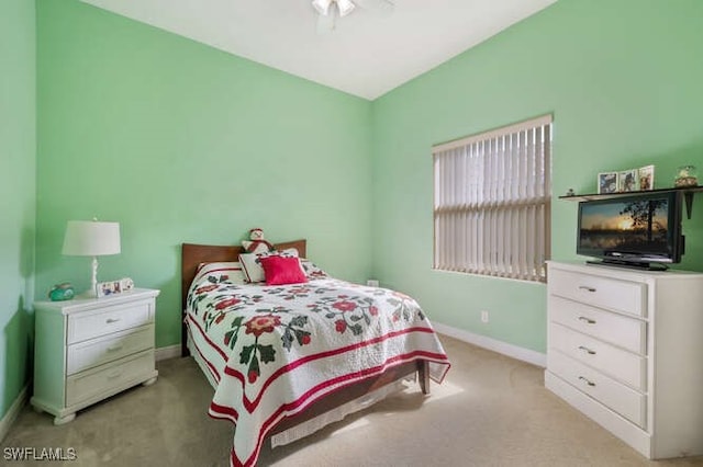 bedroom with light colored carpet