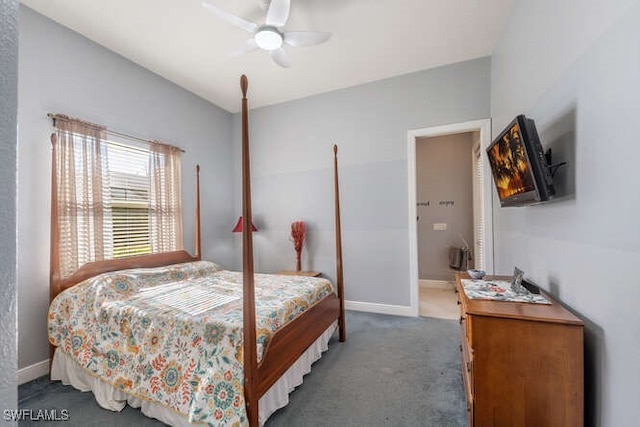 bedroom featuring ceiling fan and dark carpet