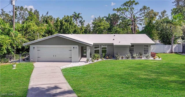 ranch-style house featuring a front yard and a garage