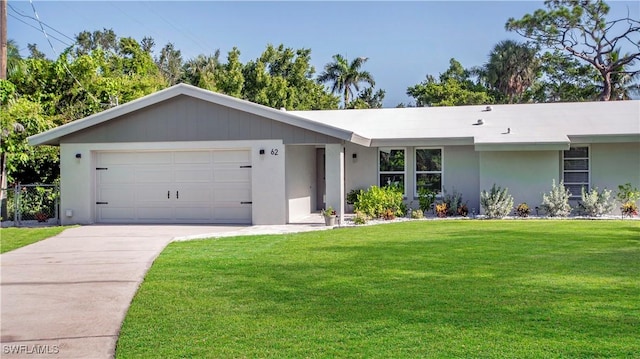 single story home featuring a front yard and a garage