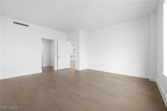 unfurnished room featuring hardwood / wood-style flooring