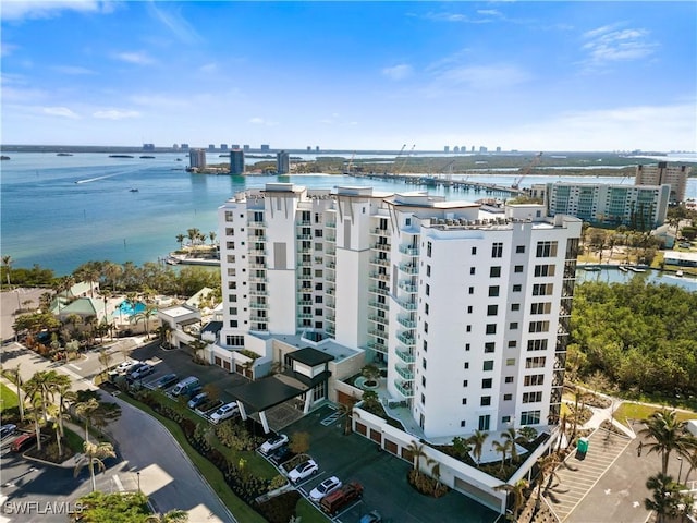 birds eye view of property with a water view