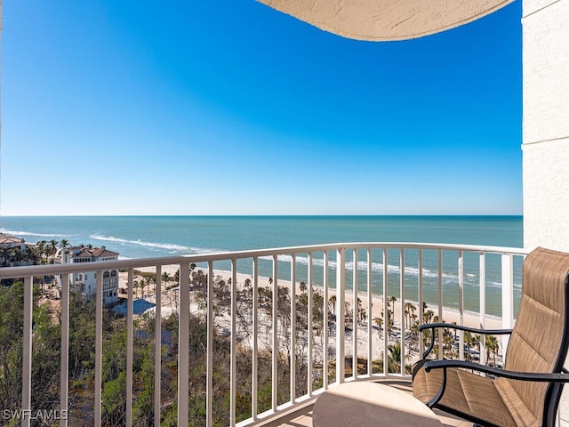 balcony with a view of the beach and a water view