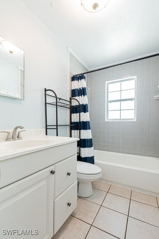 full bathroom featuring vanity, tile patterned floors, toilet, and shower / bath combo