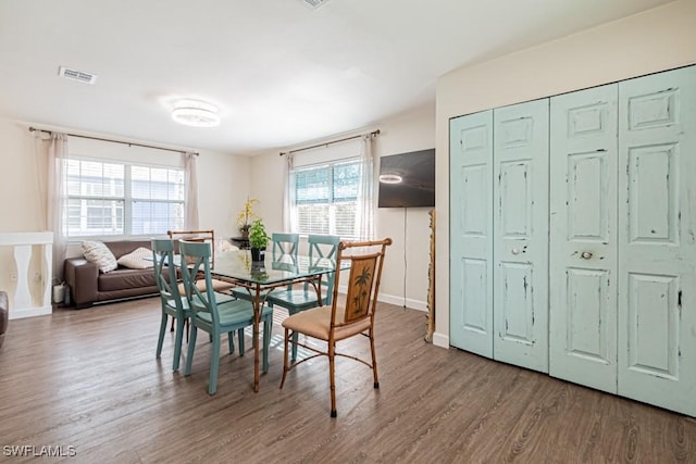 dining room with hardwood / wood-style flooring