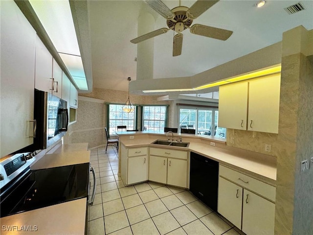 kitchen featuring dishwasher, sink, kitchen peninsula, stove, and light tile patterned flooring