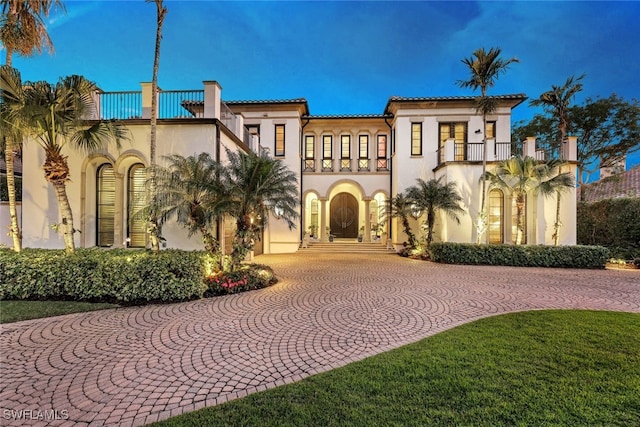 mediterranean / spanish-style house with a balcony