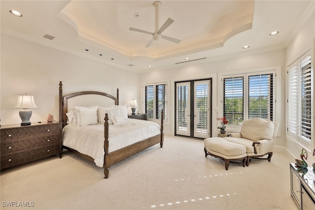 bedroom with a raised ceiling, access to exterior, ceiling fan, and light carpet