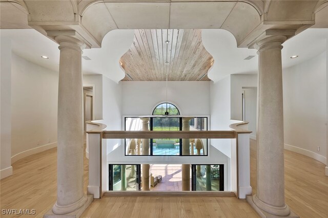 interior space featuring wood ceiling and light hardwood / wood-style flooring