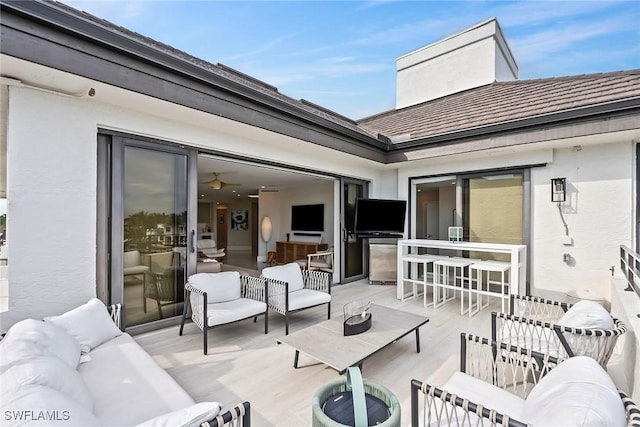 view of patio featuring outdoor lounge area and an outdoor bar