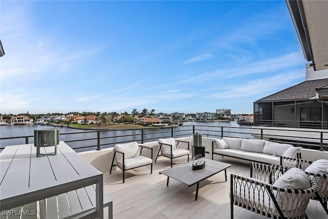 view of patio / terrace featuring outdoor lounge area and a water view