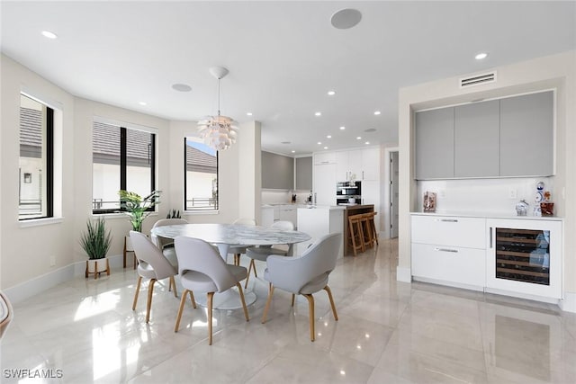 dining area featuring beverage cooler and sink