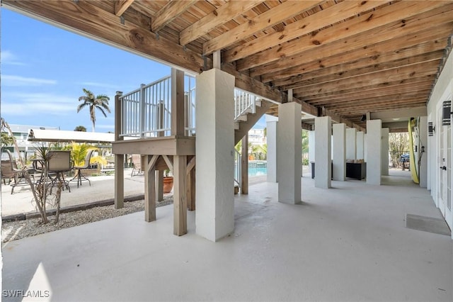 view of patio / terrace featuring stairway