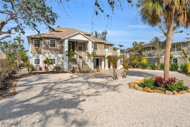 view of front of home featuring stairway