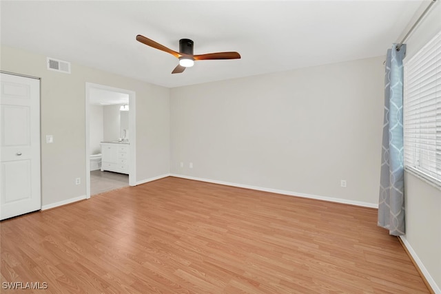 unfurnished bedroom with light wood finished floors, baseboards, and visible vents