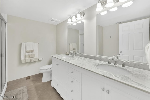 full bathroom featuring toilet, tile patterned flooring, visible vents, and a sink