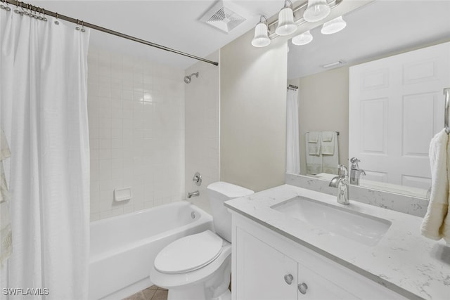 bathroom with visible vents, toilet, shower / tub combo, vanity, and tile patterned floors