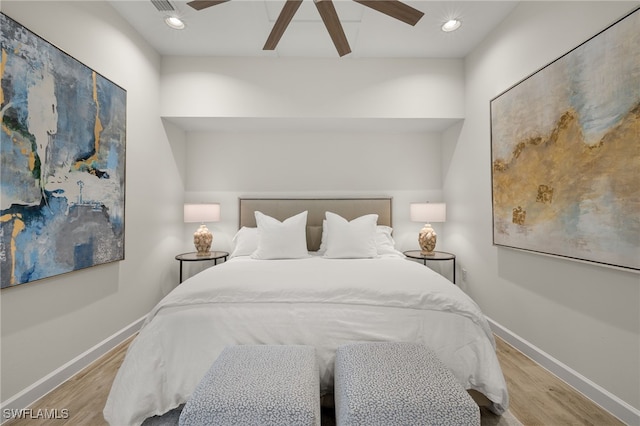 bedroom with light hardwood / wood-style flooring and ceiling fan