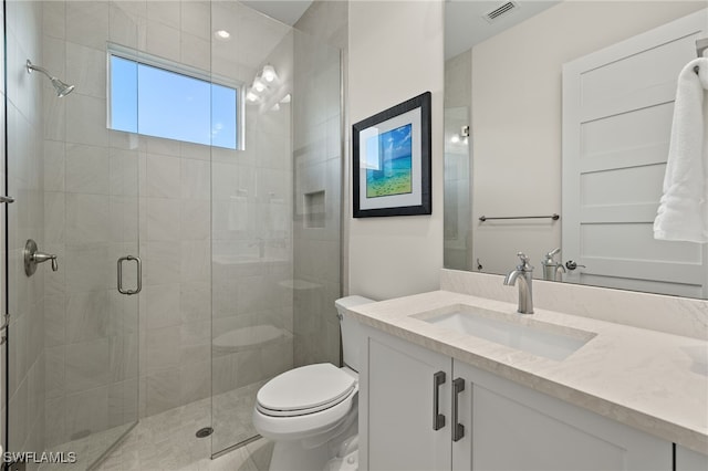 bathroom featuring walk in shower, vanity, and toilet