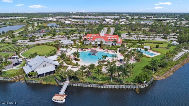 birds eye view of property with a water view