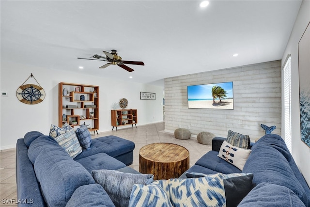 living room featuring ceiling fan and light tile patterned flooring