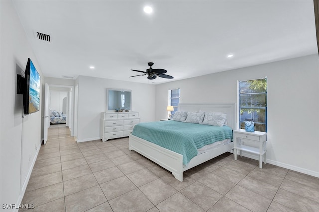 tiled bedroom featuring ceiling fan