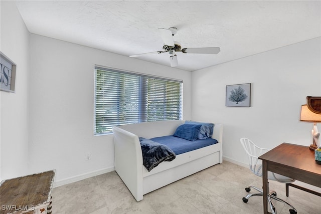 bedroom with multiple windows and ceiling fan