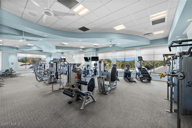 workout area with a healthy amount of sunlight, ceiling fan, and visible vents