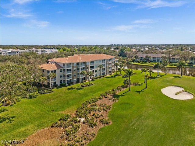 aerial view with view of golf course and a water view