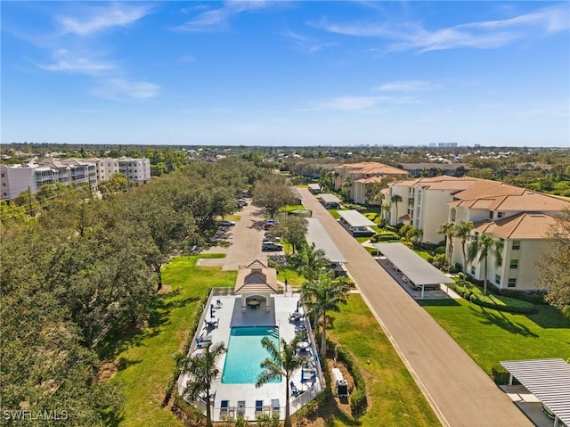 birds eye view of property with a residential view