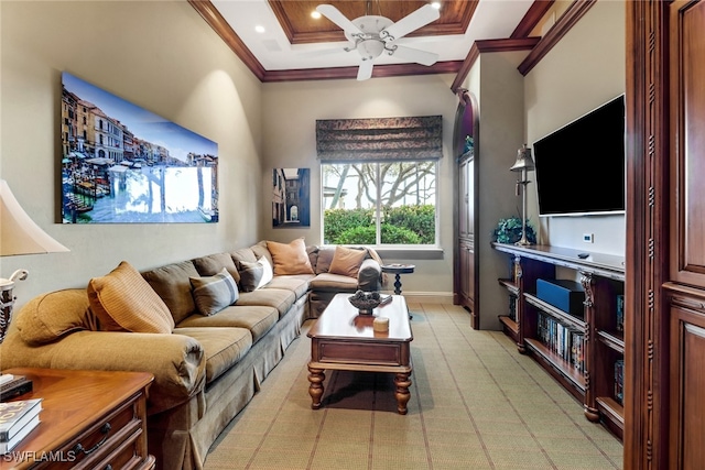 living room with ceiling fan and crown molding