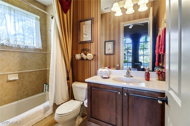 full bathroom with vanity, toilet, and shower / bathtub combination with curtain