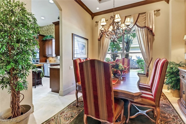 dining space featuring crown molding and an inviting chandelier