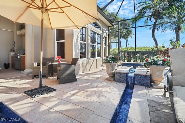 view of patio / terrace featuring a lanai