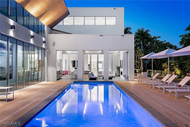 outdoor pool featuring a deck