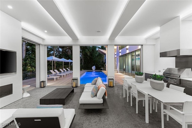 living area with beamed ceiling