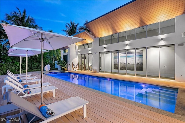 pool with a wooden deck