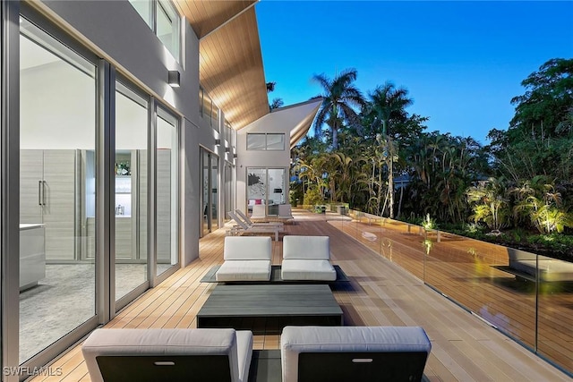 wooden terrace featuring outdoor lounge area
