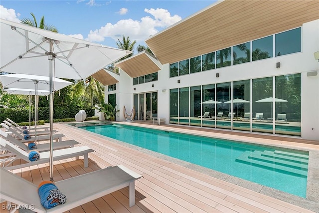 outdoor pool featuring a wooden deck