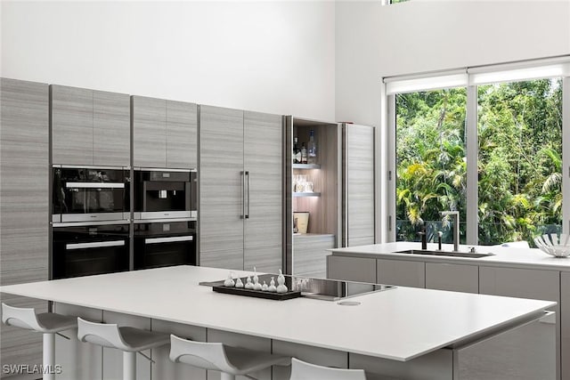 kitchen with gray cabinetry and modern cabinets