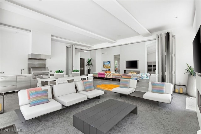living room featuring beam ceiling