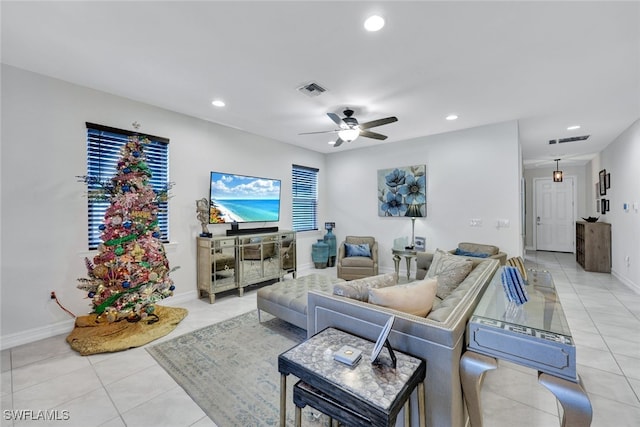 tiled living room with ceiling fan