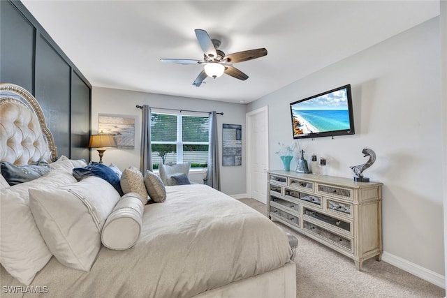 bedroom featuring ceiling fan and light colored carpet