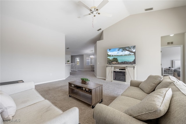 living room featuring ceiling fan with notable chandelier, light colored carpet, and high vaulted ceiling