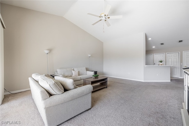 carpeted living room featuring vaulted ceiling and ceiling fan