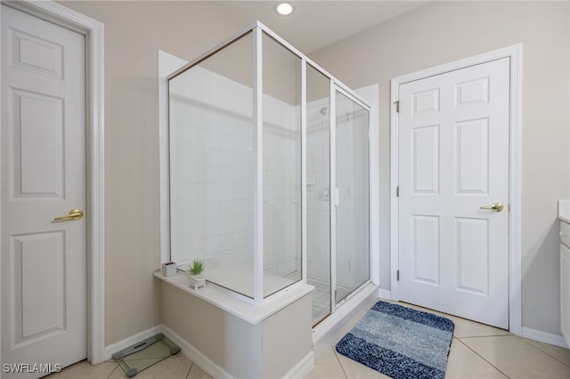 bathroom featuring tile patterned flooring and a shower with door