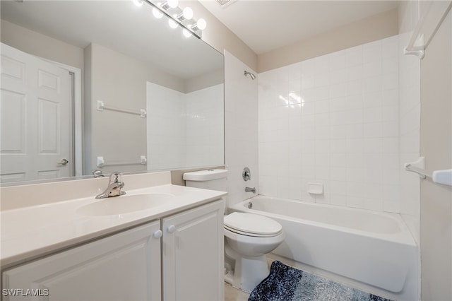 full bathroom with tiled shower / bath combo, toilet, and vanity