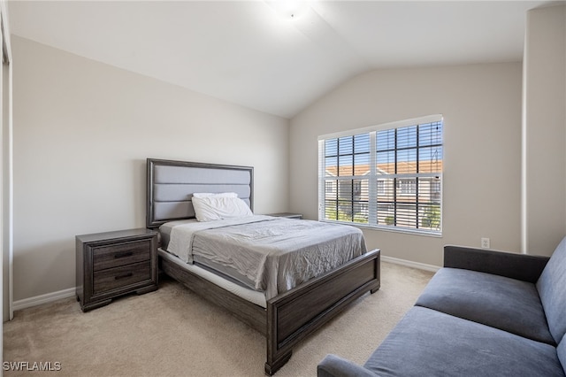 carpeted bedroom with vaulted ceiling