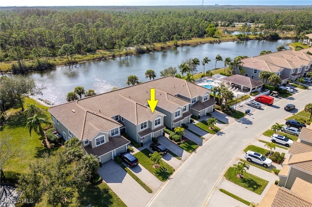 birds eye view of property featuring a water view